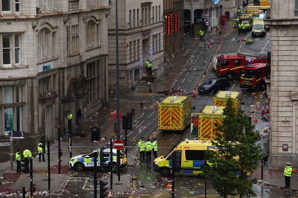 epa12137533 The scene where a car collided with Liverpool supporters during the trophy parade in Liverpool city centre, Britain, 26 May 2025. A man has been detained after the collision with a number  ...