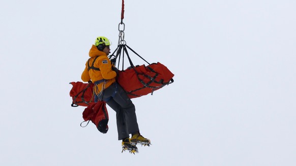 Switzerland&#039;s Mauro Caviezel is airlifted off the mountain after his crash during his run in the men&#039;s World Cup super-G ski race at Lake Louise, Alberta, Sunday, Nov. 27, 2022. (Jeff McInto ...