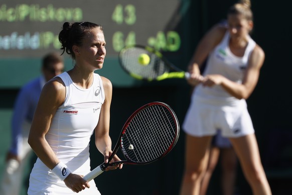 Viktorija Golubic of Switzerland, left, and Kristyna Pliskova of Czech Republic, during their ladies doubles match against Anna-Lena Groenefeld of Germany and Kveta Peschke of Czech Republic, during t ...