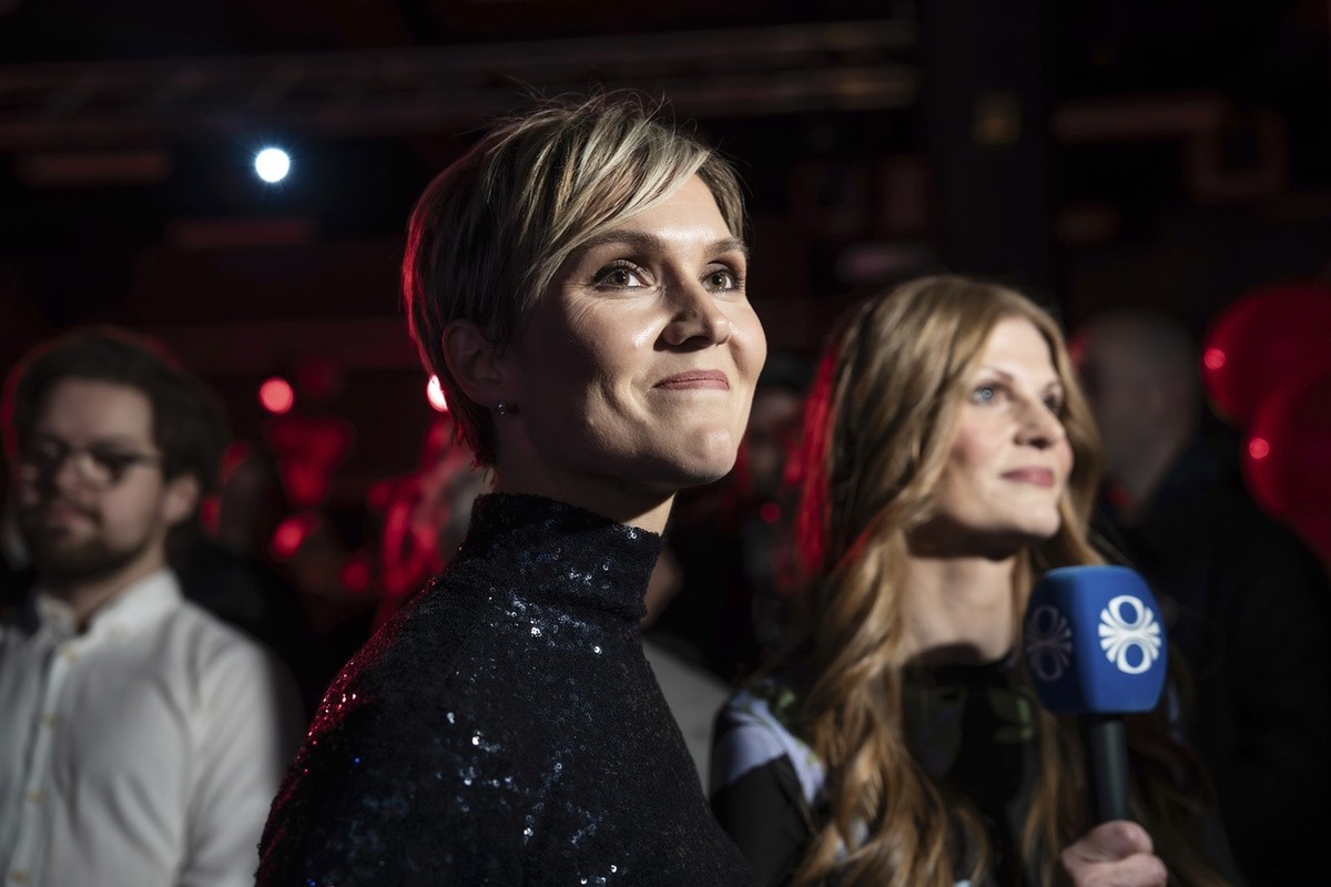 Kristrún Mjöll Frostadóttir, leader of the Samfylking, Social Democratic party, looks at the recap of the results while waiting to be interviewed live on RUV, the Icelandic National TV, in Reykjavik,  ...