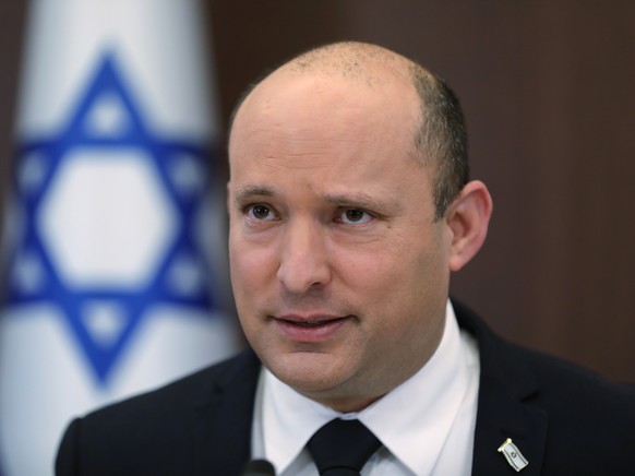 FILE - Israeli Prime Minister Naftali Bennett attends a cabinet meeting at the prime minister's office in Jerusalem, Israel Sunday, Oct. 24, 2021. Israeli lawmakers are set to begin marathon voti ...