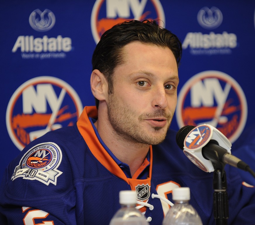 New York Islanders newly-named captain Mark Streit addresses the media during a news conference at NHL hockey training camp at Nassau Coliseum in Uniondale, N.Y., Wednesday, Sept. 21, 2011. (AP Photo/ ...