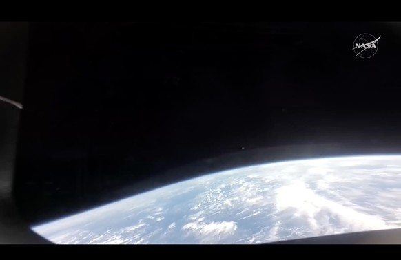 epa12881899 A handout screen grab taken from a video and made available on 10 April 2026 at 17:52 CST by the National Aeronautics and Space Administration (NASA) shows Earth as seen from the Orion spa ...