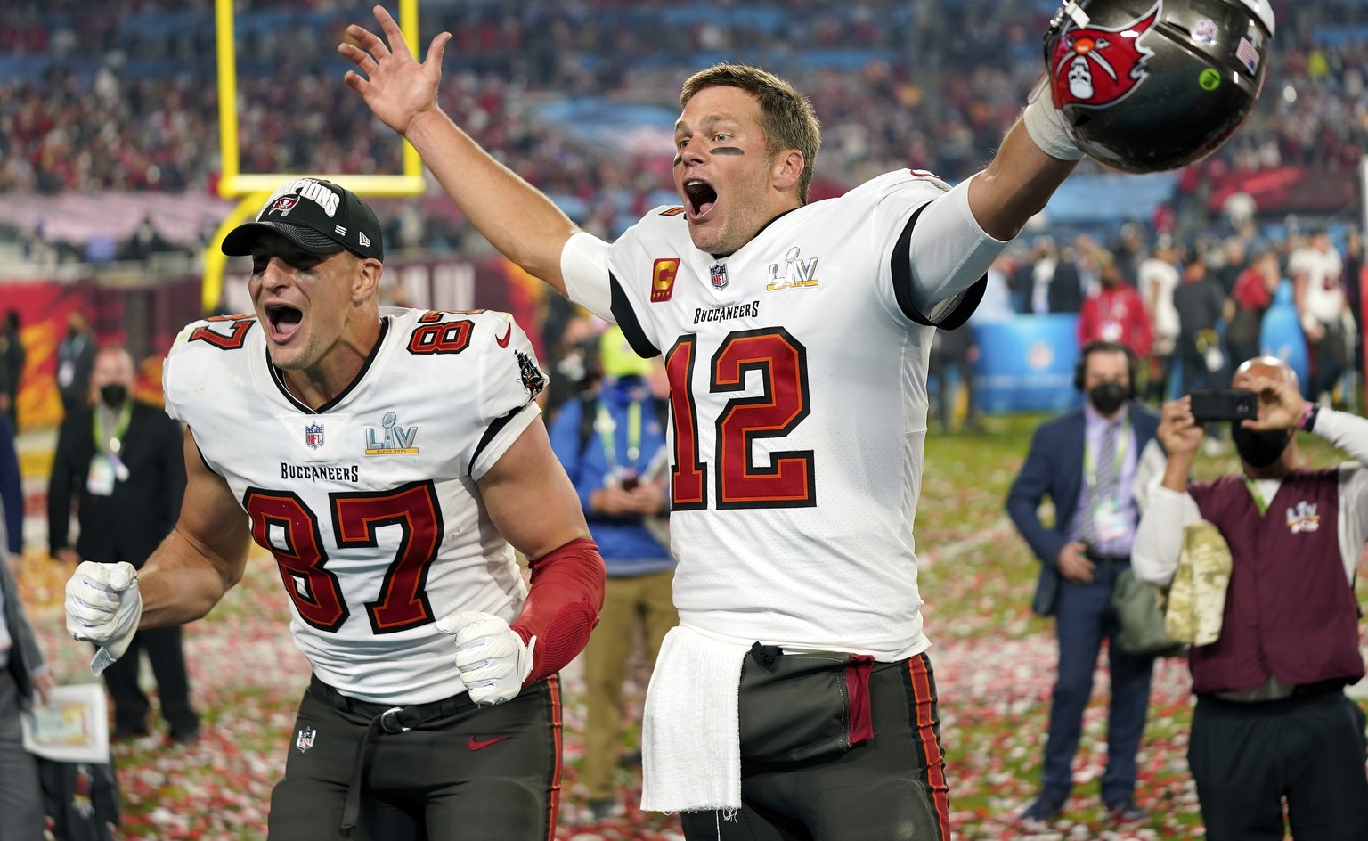 FILE - Tampa Bay Buccaneers tight end Rob Gronkowski, left, and quarterback Tom Brady (12) celebrate after the NFL Super Bowl 55 football game against the Kansas City Chiefs in Tampa, Fla., Feb. 7, 20 ...