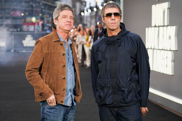 Liam Gallagher, right, and Noel Gallagher pose for photographers upon arrival at the 'Oasis: Don't Look Back In Anger' UK premiere in London, England, Monday, Sept. 7, 2026. (Photo by A ...