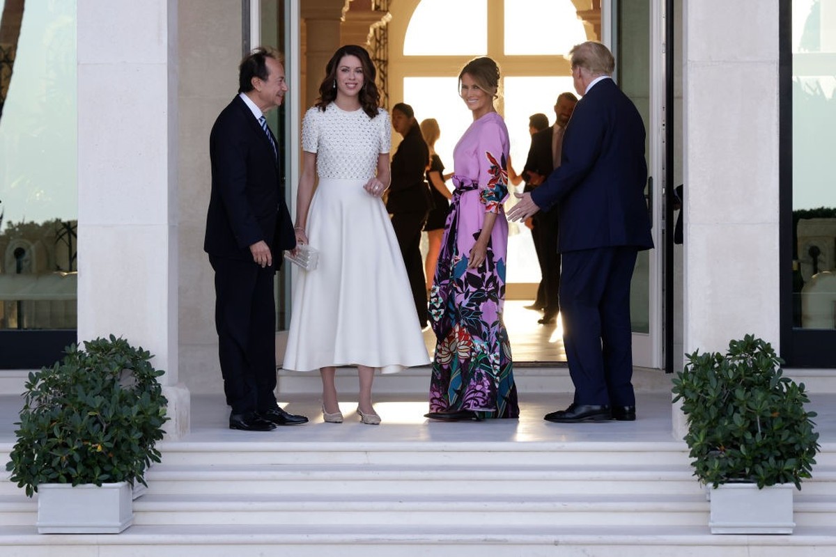 PALM BEACH, FLORIDA - APRIL 06: Republican presidential candidate and former US President Donald Trump (R) and former first lady Melania Trump (2nd-R) arrive at the home of John Paulson (L) with Alina ...
