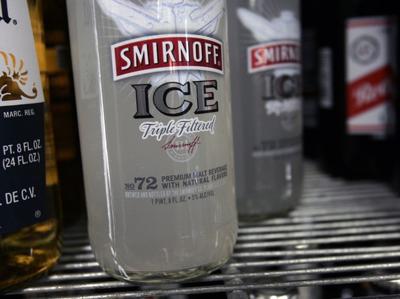 FILE - In this Jan. 28, 2008, file photo, bottles of Smirnoff Ice are seen on a cooler shelf at a store in Albany, N.Y. The vodka brand told The Associated Press on June 12, 2017, that it has launched ...