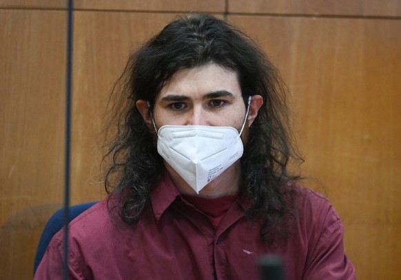 epa09781443 Defendant Franco A. sits in the dock in the courtroom of the Frankfurt Higher Regional Court, in Frankfurt am Main, Germany, 24 February 2022. The former lieutenant in the German Armed For ...