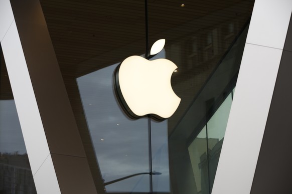 FILE - An Apple logo adorns the facade of the downtown Brooklyn Apple store on March 14, 2020, in New York. Apple Inc. plans to add several new features to Apple Pay and Apple Wallet later this year t ...