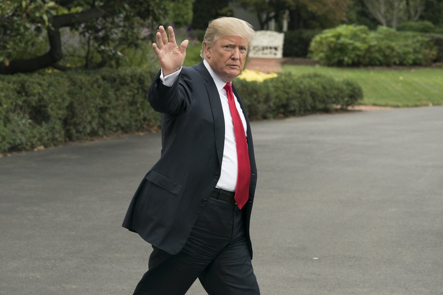 epa06259883 US President Donald J. Trump waves as he walks out to depart the South Lawn of the White House by Marine One in Washington DC, USA, 11 October 2017. Trump travels to Harrisburg, Pennsylvan ...