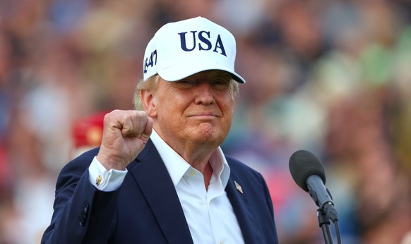 U.S. President Donald Trump gestures after the trophy presentation of the Irish Open at the Trump International Golf Links course in Doonbeg, Ireland, Sunday, Sept. 13, 2026.(AP Photo/Peter Morrison)
 ...