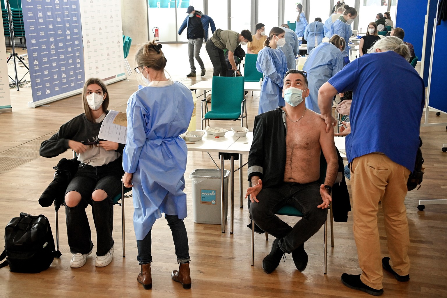 epa09184812 People receive a shot of COVID-19 vaccine at the Cologne Central Mosque in Cologne, Germany, 08 May 2021. Citizens of Cologne can receive a shot of AstraZeneca vaccine within the mosque pr ...