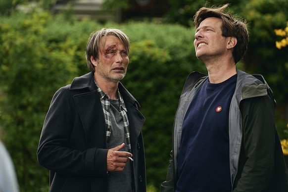 This image released by Samuel Goldwyn Films shows Mads Mikkelsen, left, with director Thomas Vinterberg on the set of &quot;Another Round.&quot; (Samuel Goldwyn Films via AP)