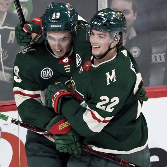 Minnesota Wild center Victor Rask (49), of Sweden, and left wing Kevin Fiala (22), of Switzerland, celebrate a goal against the Winnipeg Jets by Rask during the first period of an NHL hockey game, Tue ...