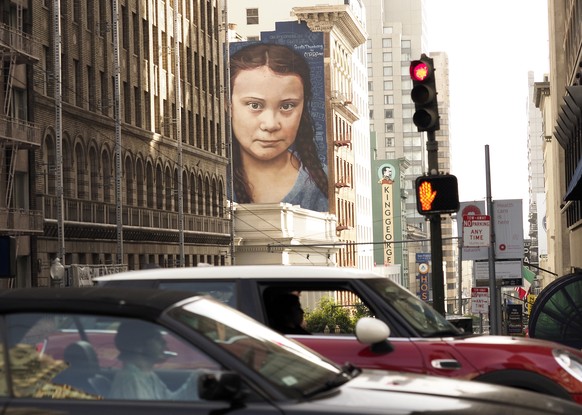 epa07991952 A mural on a side of a building depicts Swedish teenage climate activist Greta Thunberg, near Union Square in downtown San Franicsco, California, USA, 12 November 2019. The mural of Thunbe ...