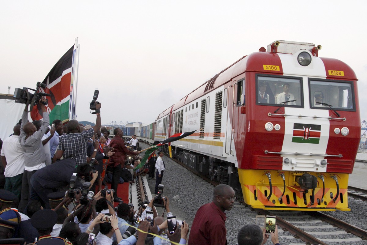 FILE - In this May 30, 2017, file photo, the SGR cargo train rides from the port containers depot on a Chinese-backed railway costing nearly $3.3 billion, opened by Kenya's president as one of th ...