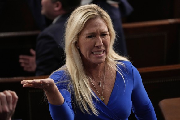 Rep. Marjorie Taylor Greene, R-Ga., talks before President Donald Trump addresses a joint session of Congress in the House chamber at the U.S. Capitol in Washington, Tuesday, March 4, 2025. (AP Photo/ ...