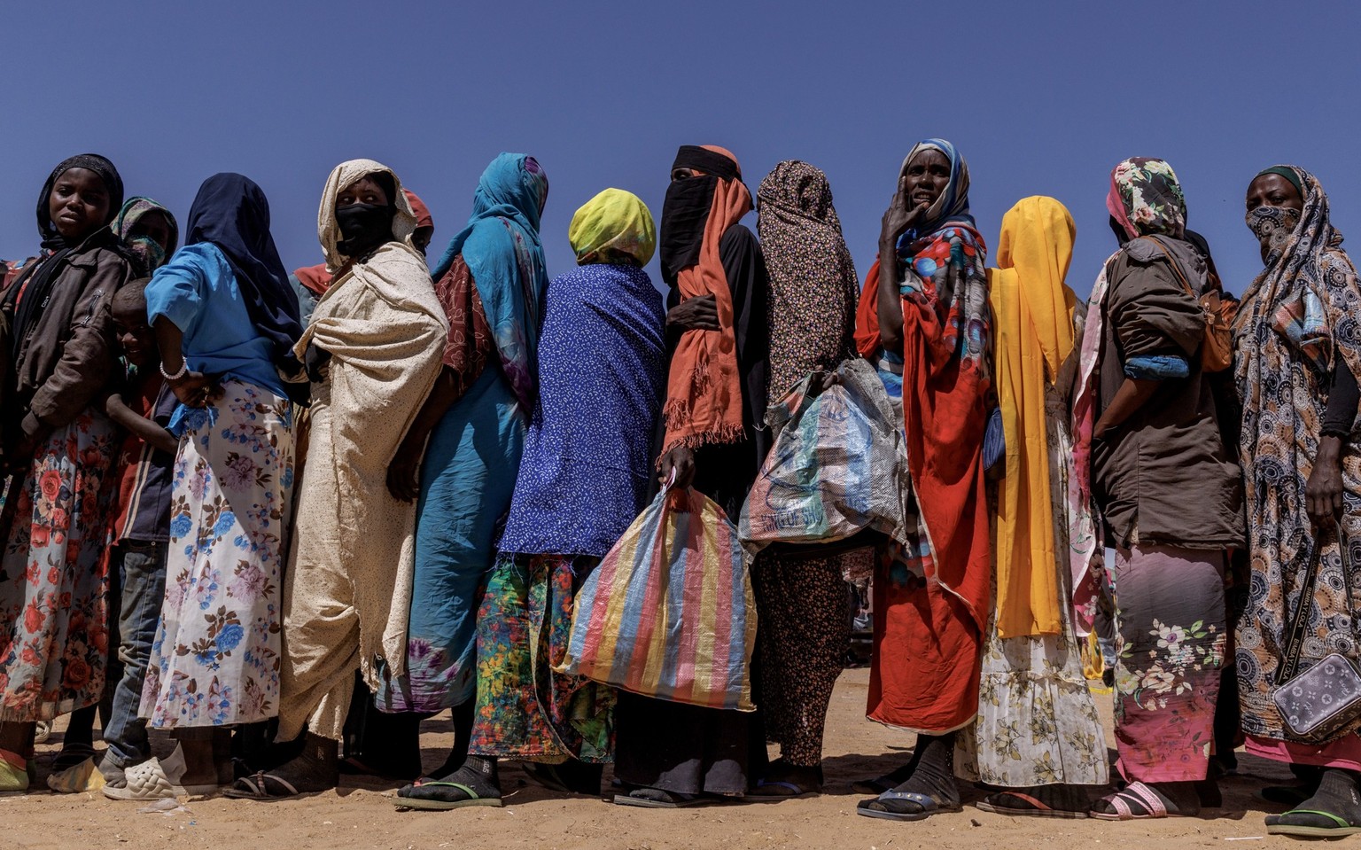 OURE CASSONI, CHAD - FEBRUARY 23: Sudanese refugees queue for biscuits at the Oure Cassoni refugee camp after arriving from Sudan, on February 23, 2026 in Oure Cassoni, Chad. In April 2023 civil war e ...