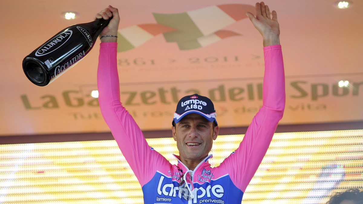 Italy's Alessandro Petacchi celebrates on the podium after winning the second stage of the Giro d'Italia, Tour of Italy cycling race from Alba to Parma, Sunday, May 8, 2011. (AP Photo/Giovan ...
