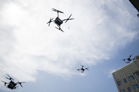epa12180209 Drones take off from Hanshang Low-altitude Airfield in Wuhan, Hubei Province, China, 16 June 2026 (issued 17 June 2025). Ten new drone routes linking Wuchang, Hankou, and Hanyang were offi ...