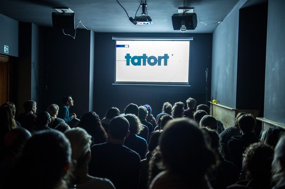 epa05191265 A picture dated 28 February 2016 shows the lettering &#039;Tatort&#039; on the big screen at the Comedy Cafe Berlin, in Berlin, Germany. At the Berlin-Neukoelln pub, guests can now watch a ...