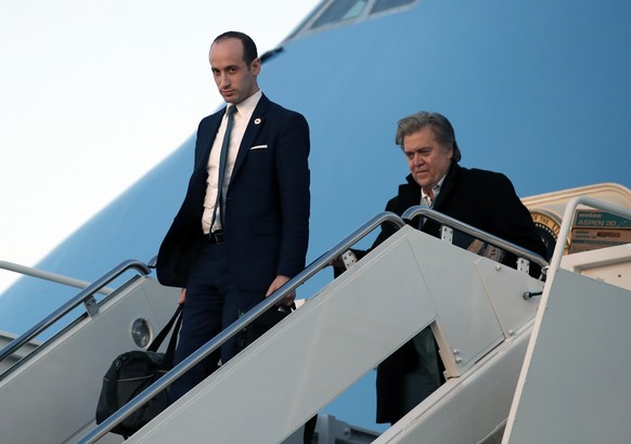 White House Senior Adviser Stephen Miller, left, and chief strategist Steve Bannon disembark Air Force One as they arrive Sunday, March 5, 2017, at Andrews Air Force Base, Md. (AP Photo/Alex Brandon)