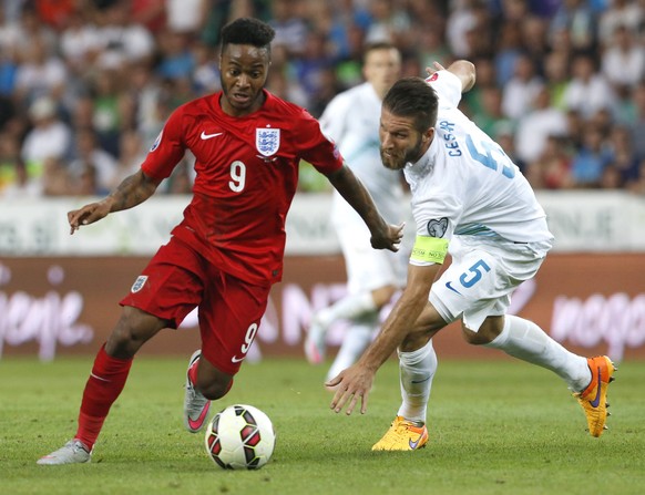 epa04799483 England&#039;s Raheem Sterling (L) in action against Slovenian&#039;s Bostjan Cesar (R) during the UEFA EURO 2016 qualification soccer match between Slovenia and England in Ljubljana, Slov ...