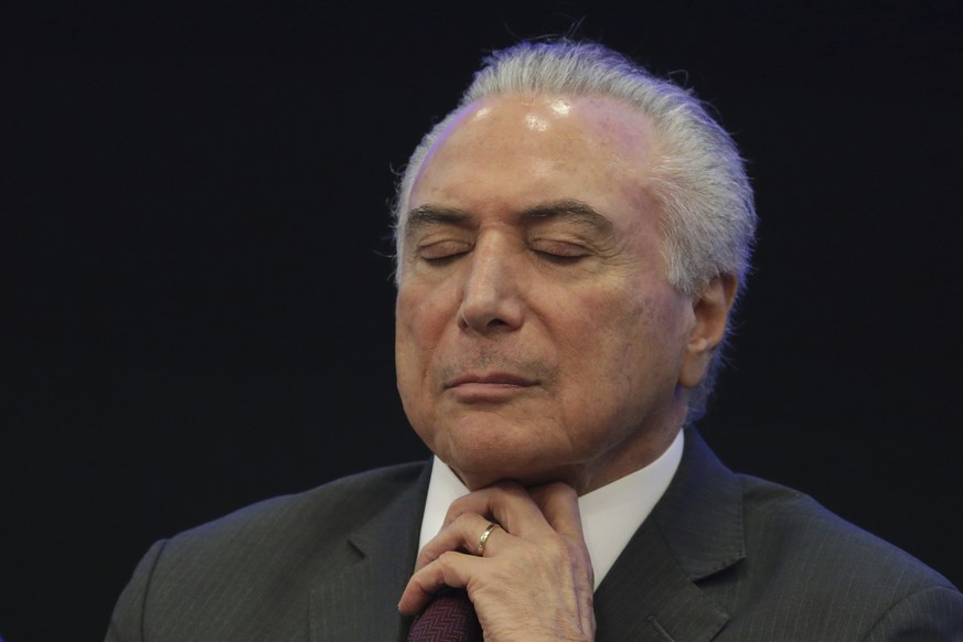 Brazil&#039;s President Michel Temer closes his eyes during a event at the Brazilian Institute of Research in Brasilia, Brazil, Monday, May 8, 2017. Temer promised to unify a fractured society, pull t ...