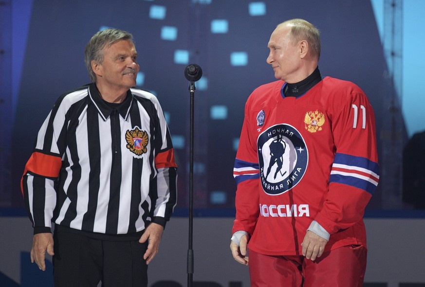 FILE - Russian President Vladimir Putin, right, and IIHF President Rene Fasel attend a gala match with the participation of Russian hockey legends as part of the final stage of the X All-Russian Night ...