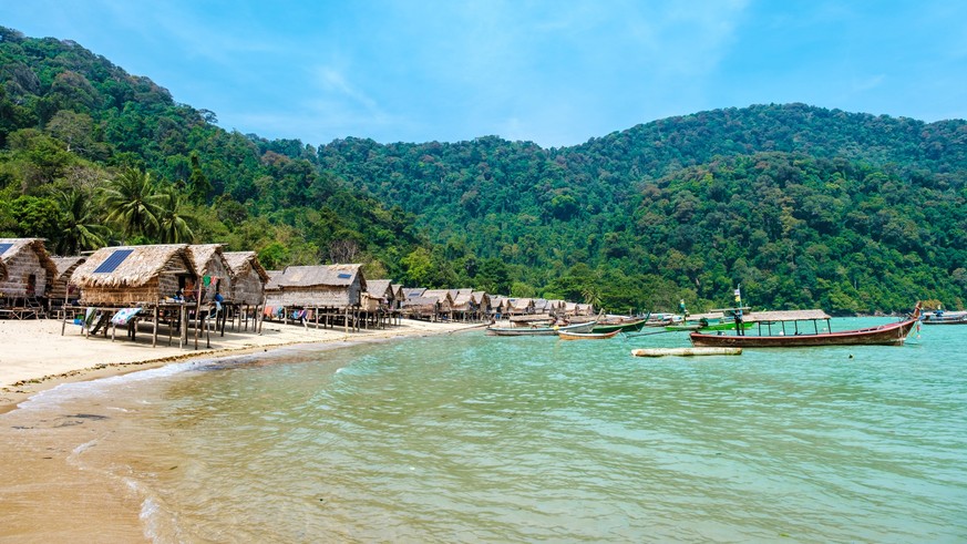 Experience the tranquility of Surin Islands remote beach and vibrant fishing boats Experience the tranquility of Surin Islands remote beach and vibrant fishing boats Copyright: xZoonar.com/FokkexBaars ...