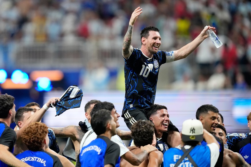 Argentina's Lionel Messi celebrates with his teammates at the end of the World Cup semifinal soccer match between England and Argentina in Atlanta, Wednesday, July 15, 2026. (AP Photo/Rebecca Bla ...