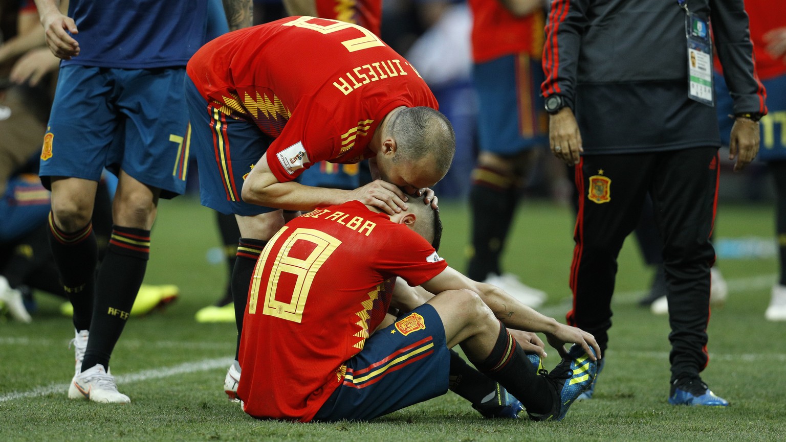 Spain&#039;s Andres Iniesta, above, comforts Spain&#039;s Jordi Alba at the end of the round of 16 match between Spain and Russia at the 2018 soccer World Cup at the Luzhniki Stadium in Moscow, Russia ...