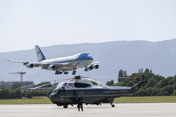 KEYPIX - Air Force One carrying US President Donald Trump, over the Marine One helicopter as it lands at Geneva Airport for France's G7 summit in Evian, Geneva, Switzerland, Monday, June 15, 2026 ...