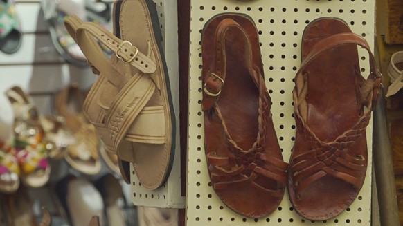 epa12290627 Traditional huaraches are displayed at a market in Oaxaca, Mexico, 08 August 2025. After Mexican President Claudia Sheinbaum spoke out against Adidas' alleged plagiarism of the design ...
