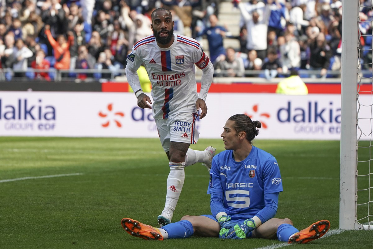 Lyon's Alexandre Lacazette celebrates scoring his side's 2nd goal during the French League One soccer match between Lyon and Rennes at the Groupama stadium, in Decines, near Lyon, France, Su ...
