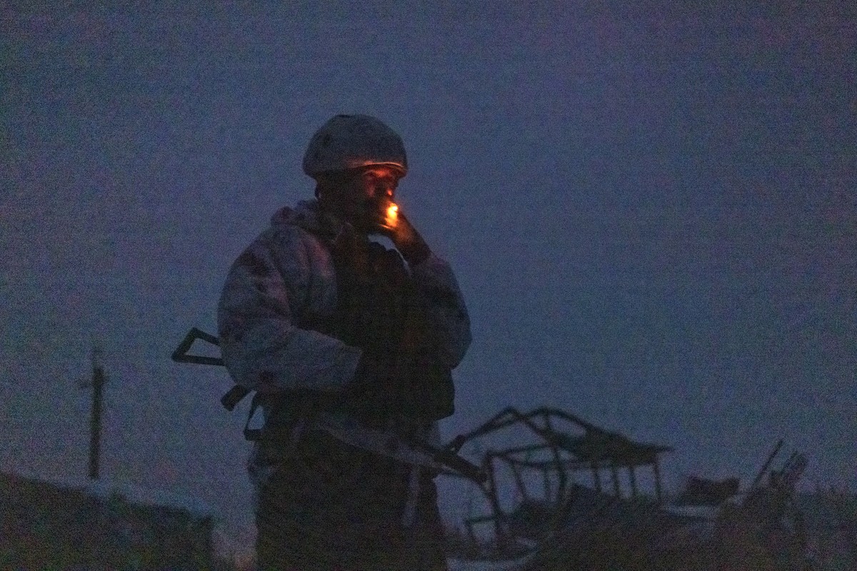 A Ukrainian soldier smokes at the line of separation from pro-Russian rebels, Donetsk region, Ukraine, Thursday, Dec 30, 2021. Presidents Joe Biden and Vladimir Putin spoke by phone on Thursday about  ...