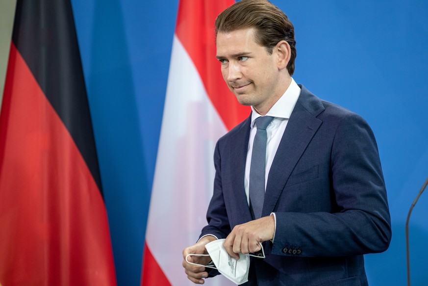 epa09438313 Austrian Chancellor Sebastian Kurz attends a joint press conference with German Chancellor Merkel at the Chancellery in Berlin, Germany, 31 August 2021. German Chancellor Merkel and Austri ...