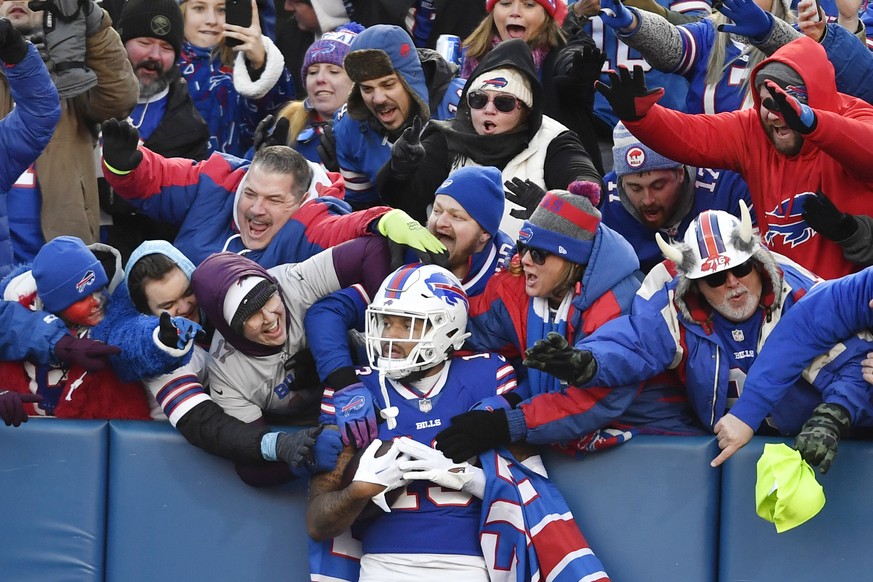 Buffalo Bills wide receiver Gabe Davis (13) is congratulated by fans after his touchdown during the second half of an NFL wild-card playoff football game against the Miami Dolphins, Sunday, Jan. 15, 2 ...