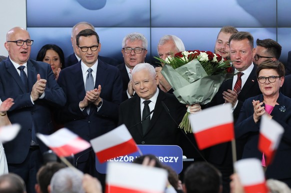 epa10920955 Leader of the Polish Law and Justice (PiS) rulling party Jaroslaw Kaczynski (C) reacts during Law and Justice party parliamentary elections night in Warsaw, Poland, 15 October 2023 in Wars ...