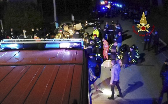 In this frame taken from video rescuers assist injured people outside a nightclub in Corinaldo, central Italy, early Saturday, Dec. 8, 2018. At least Six people, all but one of them minors, were kille ...