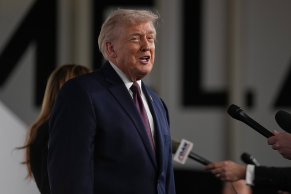President Donald Trump and first lady Melania Trump arrive for the premiere of her movie "Melania" at The John F. Kennedy Memorial Center For The Performing Arts, Thursday, Jan. 29, 2026, in ...