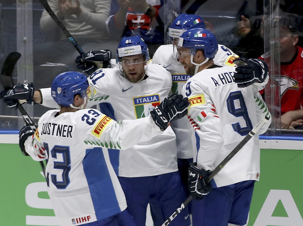 Italy's players celebrate after scoring during the Ice Hockey World Championships group B match between Austria and Italy at the Ondrej Nepela Arena in Bratislava, Slovakia, Monday, May 20, 2019. ...