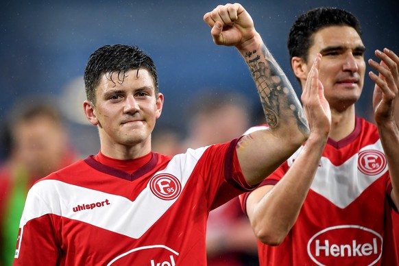 epa07408905 Duesseldorf&#039;s Dawid Kownacki (L) reacts after winning the German Bundesliga soccer match between FC Schalke 04 and Fortuna Duesseldorf in Gelsenkirchen, Germany, 02 March 2019. EPA/FR ...