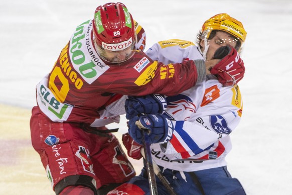 Tigers, Chris DiDomenico, links, kaempft um den Puck, gegen Lions Topscorer, Pius Suter, rechts, waehrend dem Meisterschaftsspiel der National League, zwischen den SCL Tigers und den ZSC Lions, am Fre ...