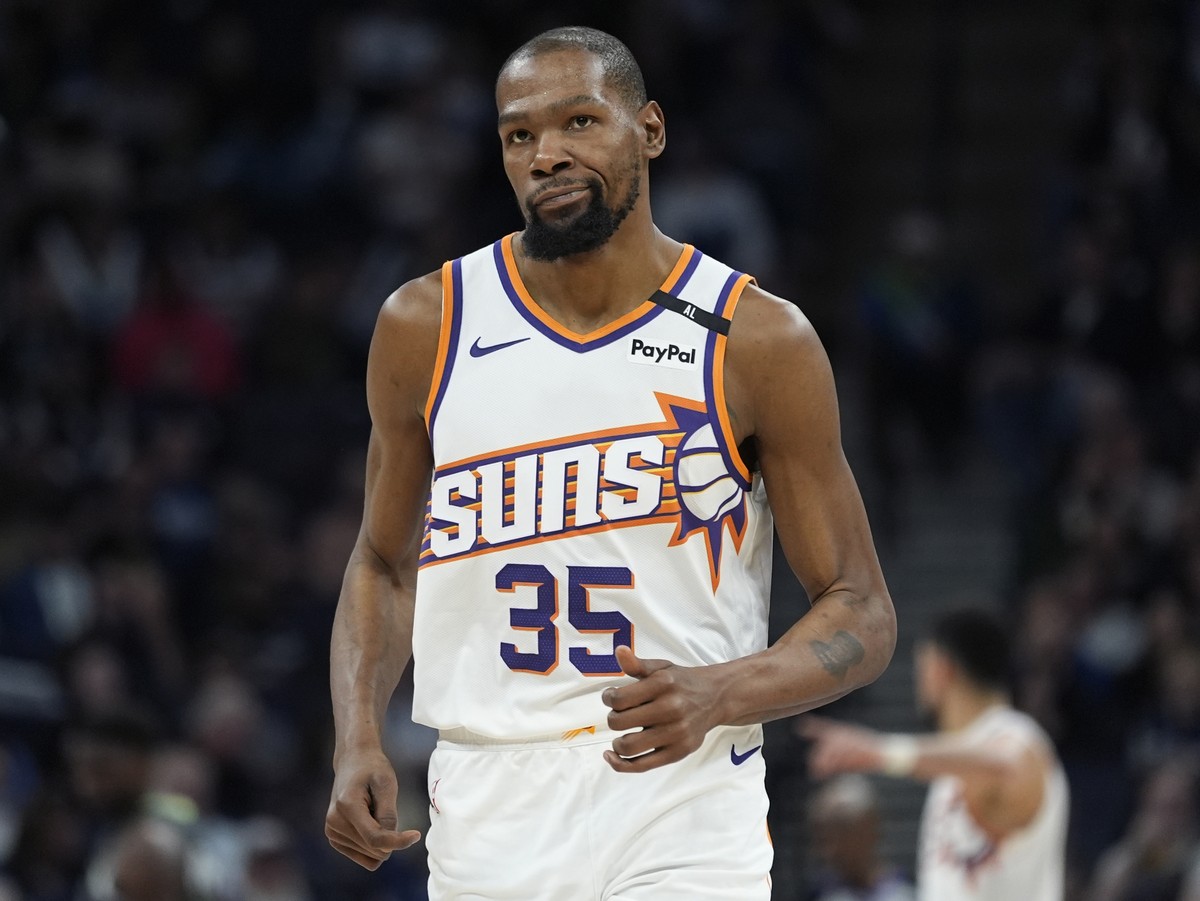 Phoenix Suns forward Kevin Durant jogs down the court during the second half of an NBA basketball game against the Minnesota Timberwolves, Friday, March 28, 2025, in Minneapolis. (AP Photo/Abbie Parr) ...