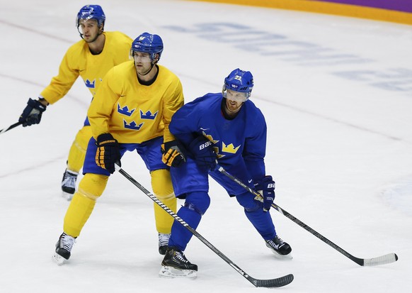 Daniel Sedin (r.) und Daniel Alfredson (Mitte): Holen die Schweden dank den Topstürmern zum dritten Mal Olympia-Gold?