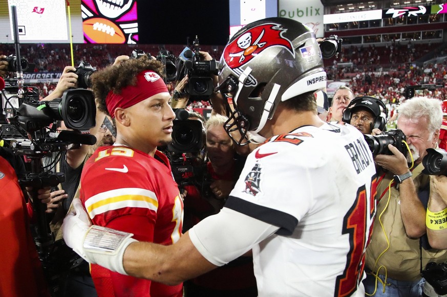 October 2, 2022, Tampa, Florida, USA: Kansas City Chiefs quarterback Patrick Mahomes 15, left, shales hands with Tampa Bay Buccaneers quarterback Tom Brady 12 at mid field after a 41 to 31 Bucs loss a ...
