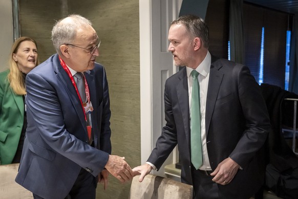 Switzerland's Federal President Guy Parmelin, left, shakes hands with US Trade Representative Jamieson Greer, right, during a bilateral meeting at the 56th annual meeting of the World Economic Fo ...