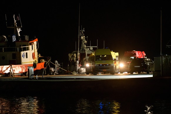 epa12703626 Ambulances transport injured people at a port in Chios Island, Greece, 03 February 2026. At least 14 people were killed after a collision between a speedboat carrying migrants and a Greek  ...