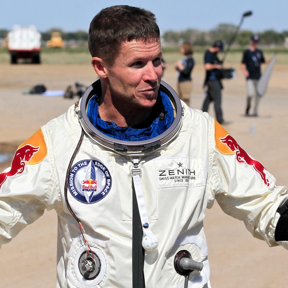 FILE - Felix Baumgartner of Austria gestures prior to speaking with the media after successfully jumping from a space capsule lifted by a helium balloon in Roswell, N.M., Oct. 14, 2012. (AP Photo/Ross ...